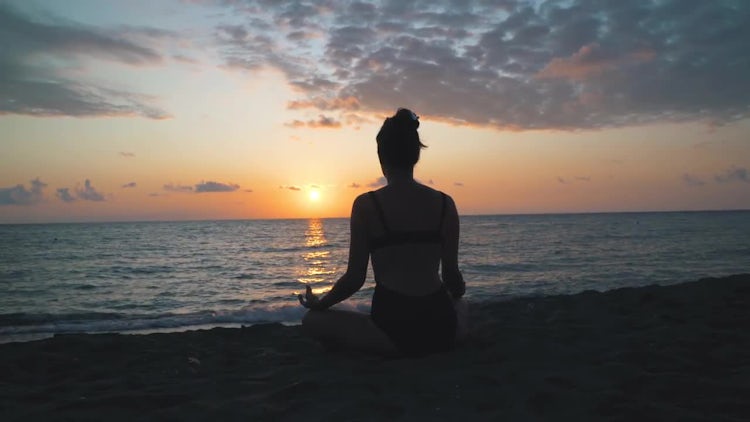 Meditating On The Beach: Stock Video