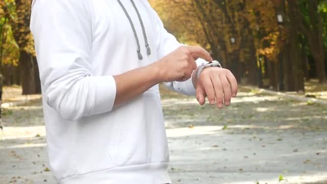 Using Smartwatch In Autumn: Stock Video