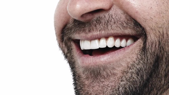 A CLOSE UP of a man smiling menacingly, , Stock Video