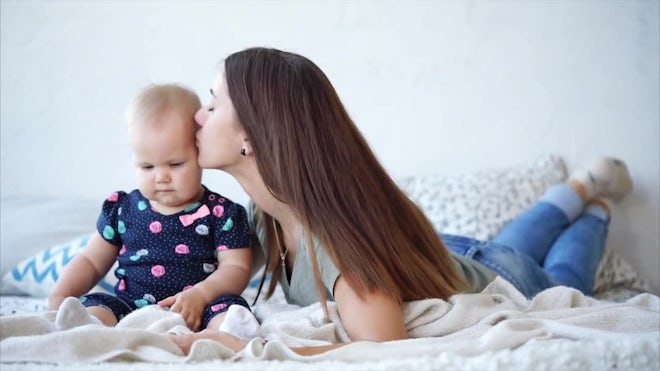 Mother Kissing Daughter - Stock Video | Motion Array
