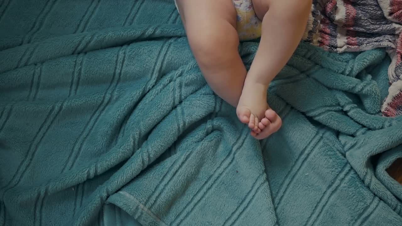 Wriggling Baby's Feet Stock Video Motion Array