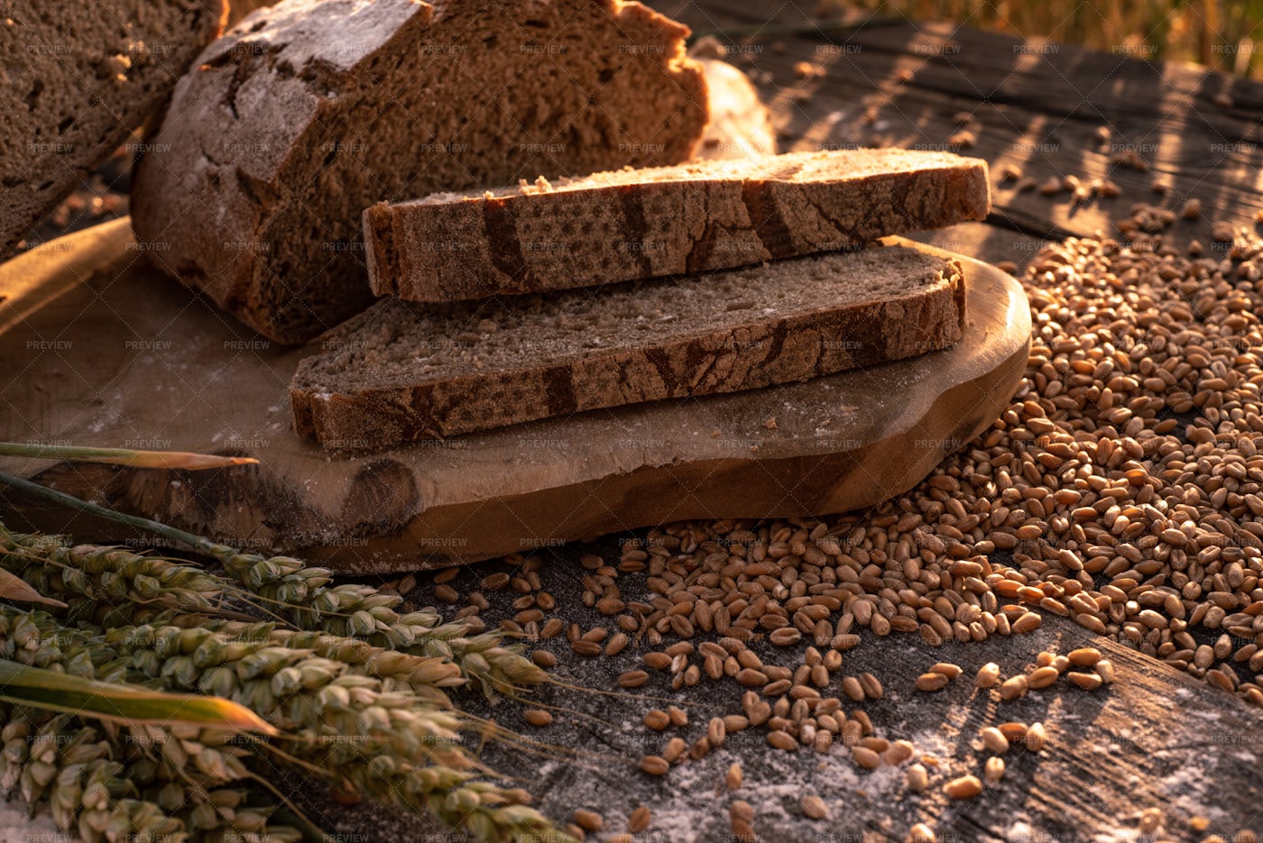 Bread Slices And Wheat In Summer Sun: Stock Photos