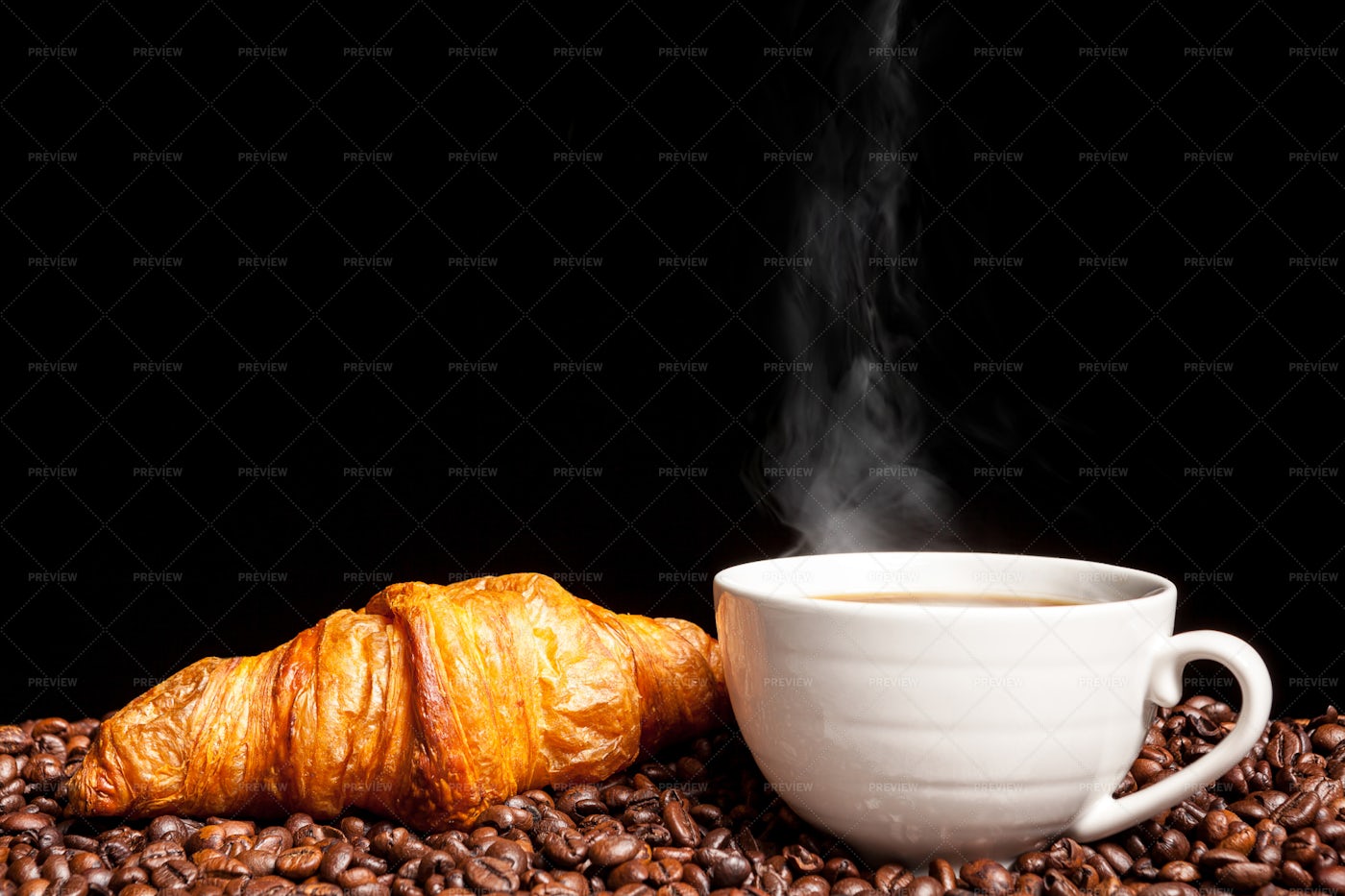 Croissant With Steaming Coffee: Stock Photos