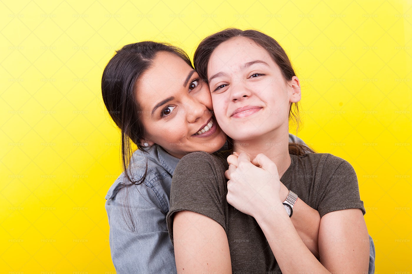 Bigger Sister Embracing The Younger: Stock Photos