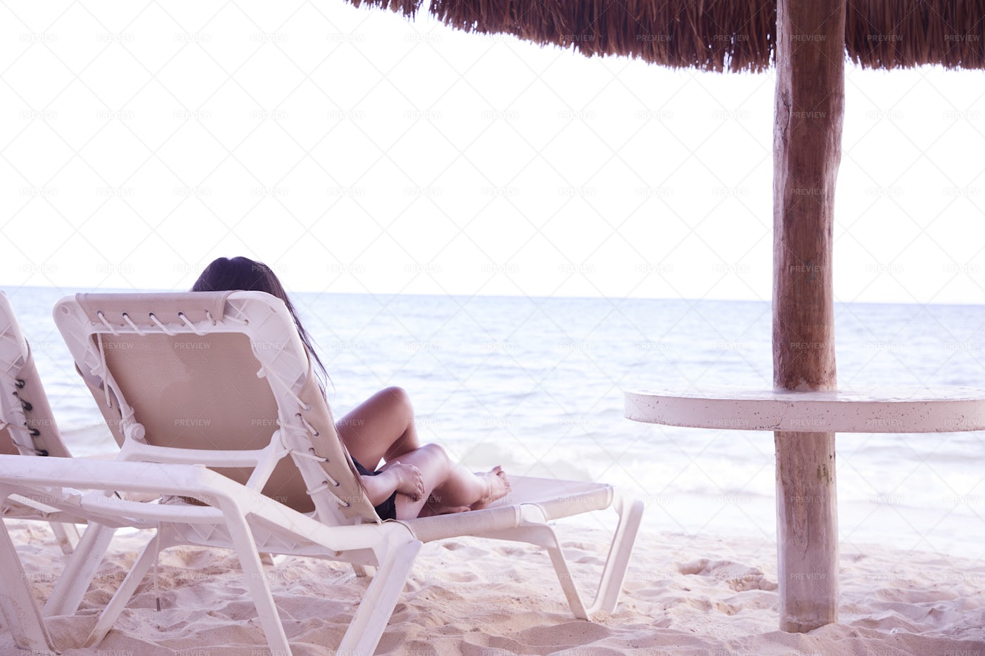 Reclining By the Shore: Stock Photos