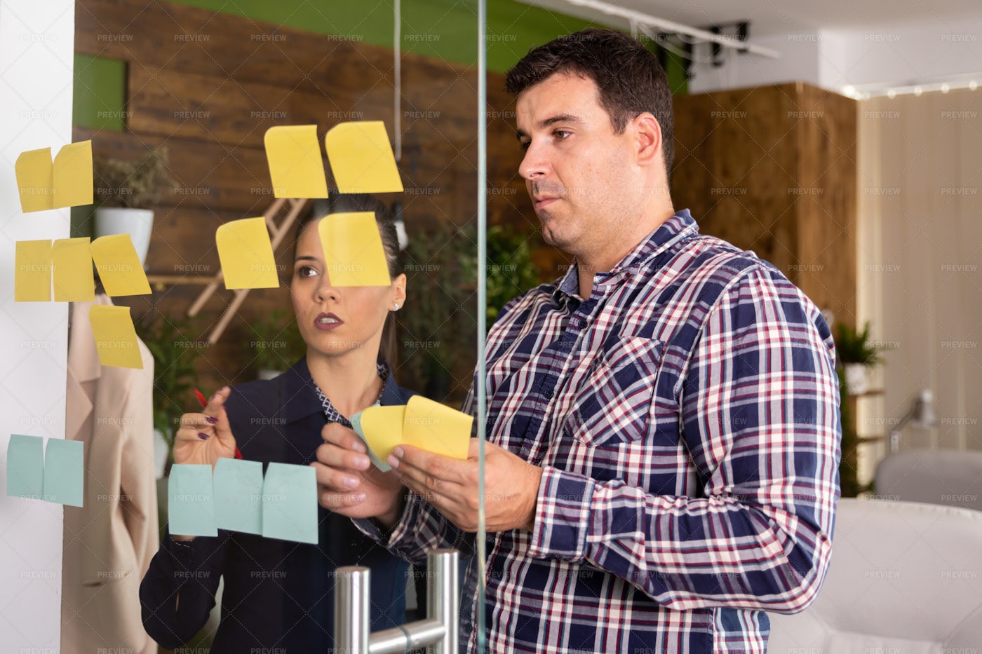 Creative Team Making Notes: Stock Photos