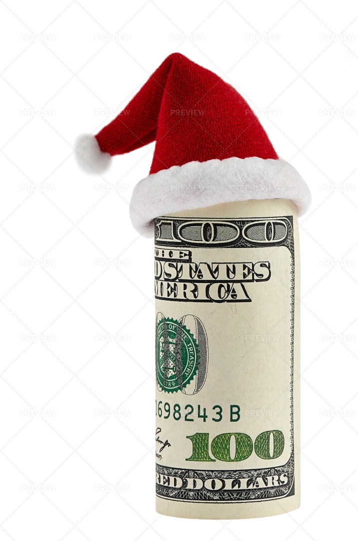 100 Dollar Roll In Christmas Hat: Stock Photos
