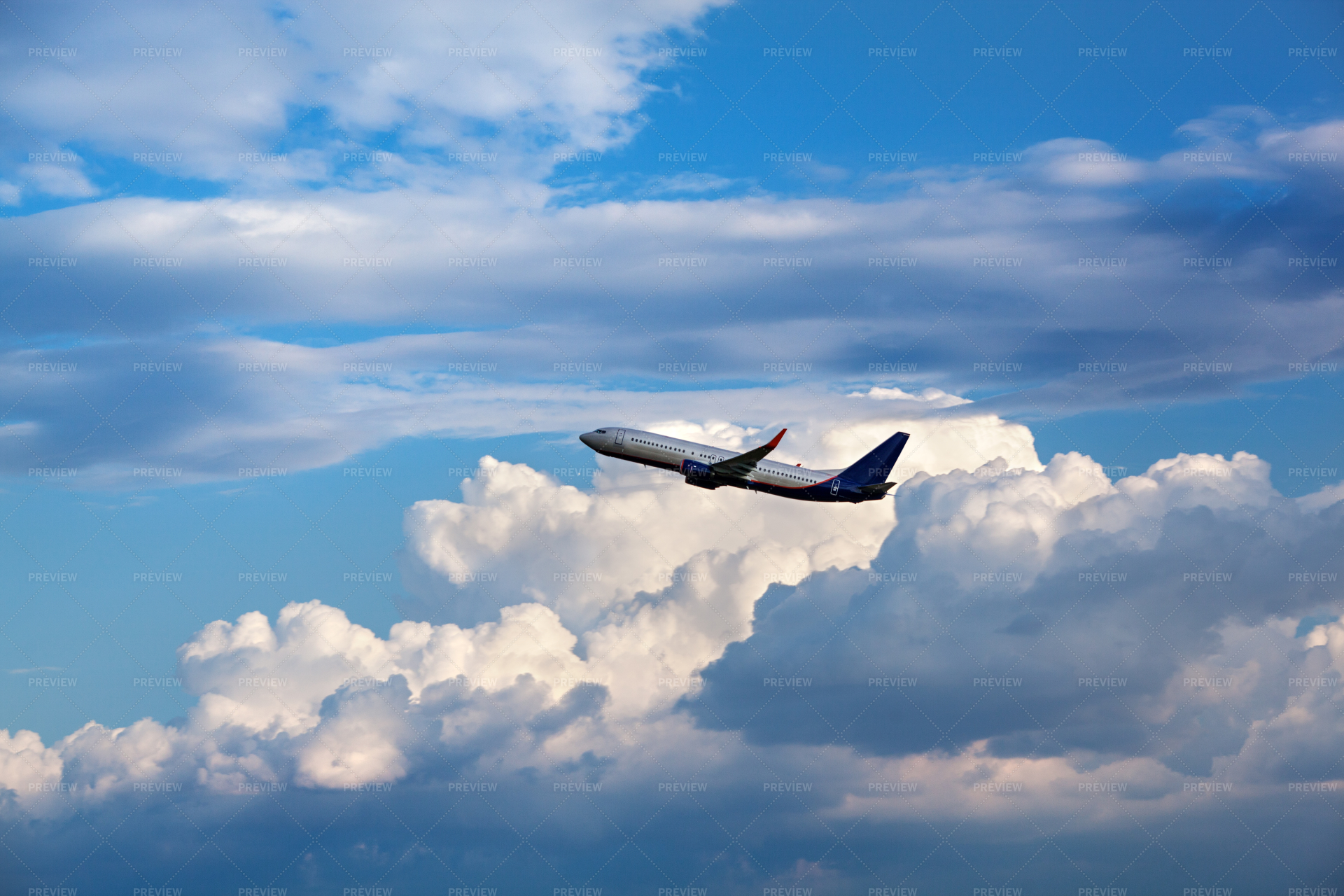 Airplane In The Clouds - Stock Photos | Motion Array