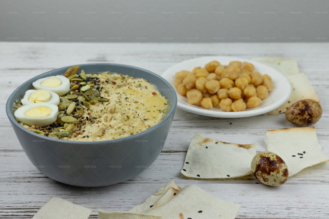 Hummus, Quail Eggs, And Pita: Stock Photos