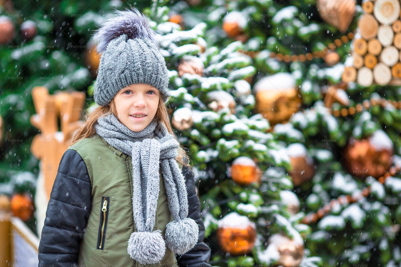 Girl Near Snowy Christmas Trees: Stock Photos