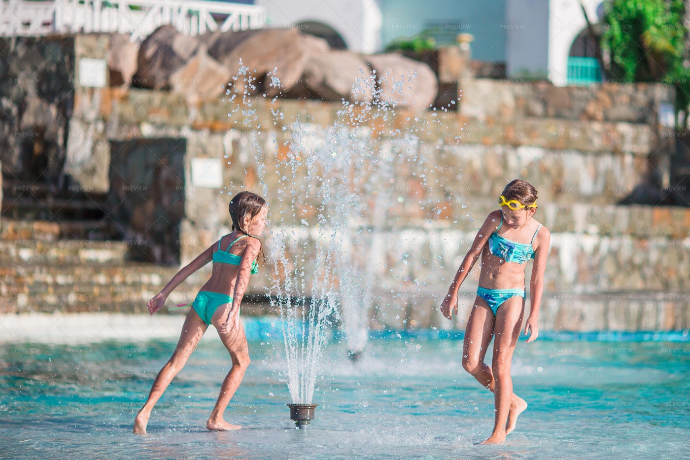 Playing At The Water Fountain: Stock Photos