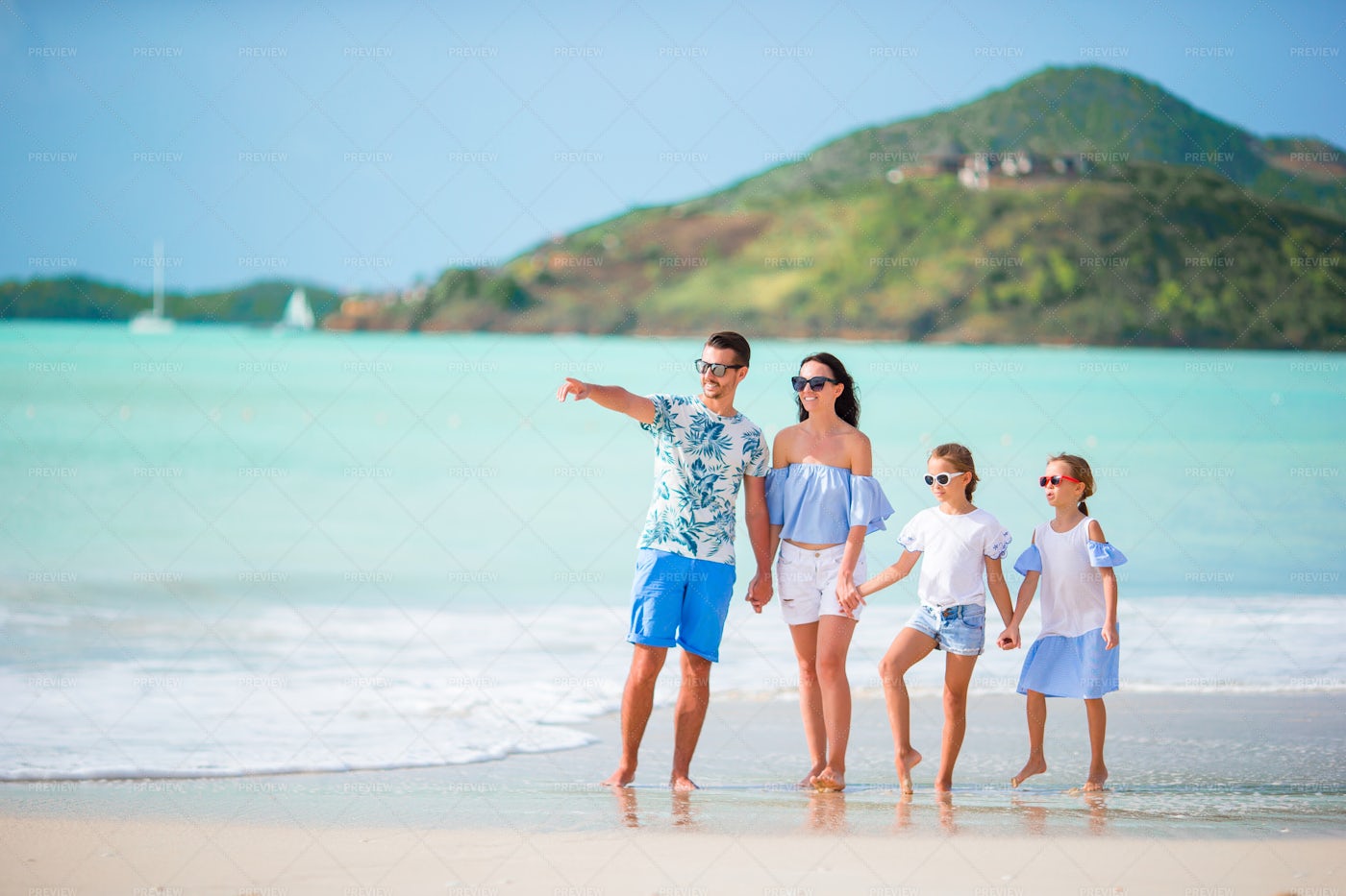 Joyful Family At The Beach: Stock Photos