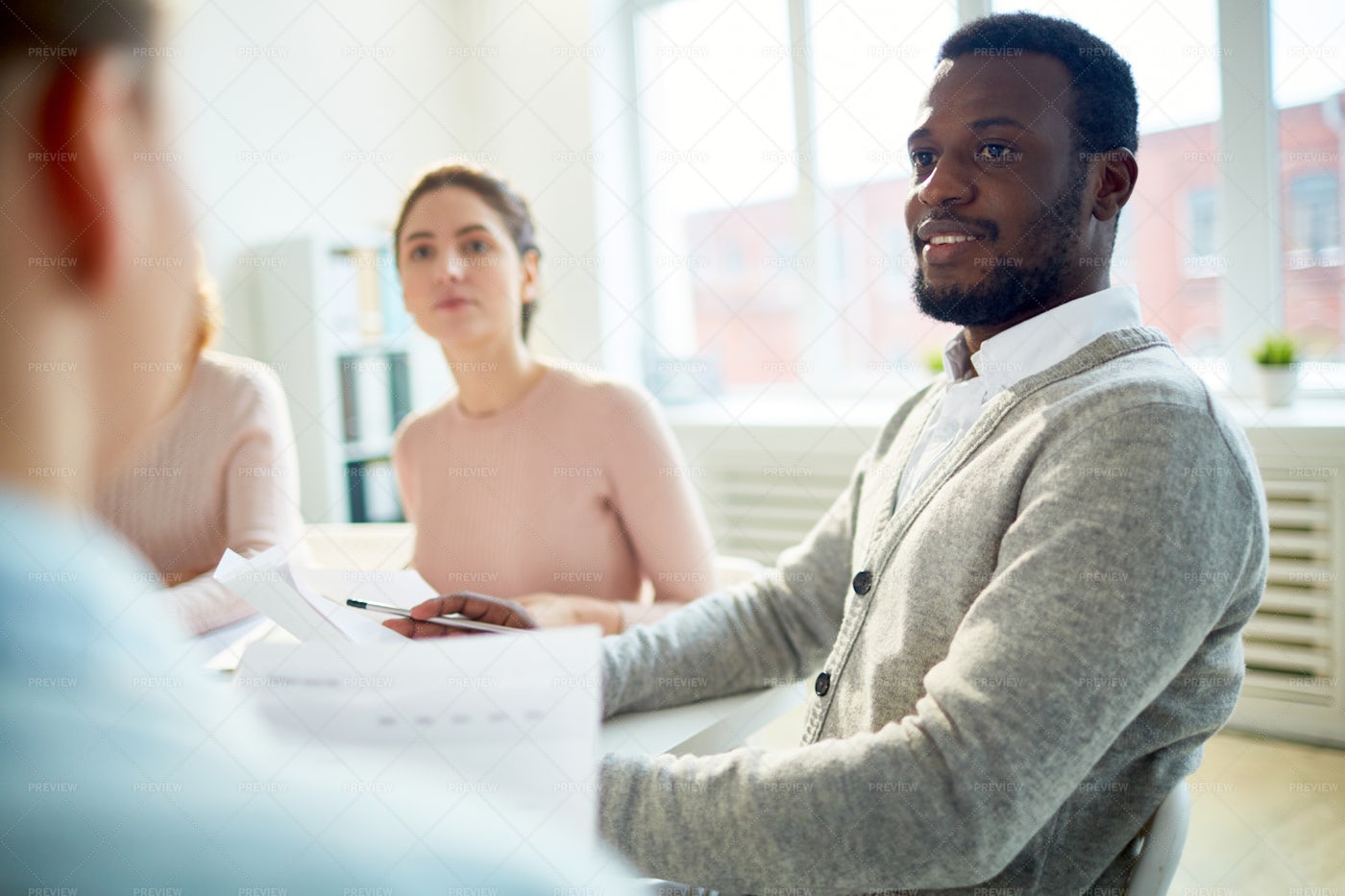 Working Meeting At Open Plan Office: Stock Photos