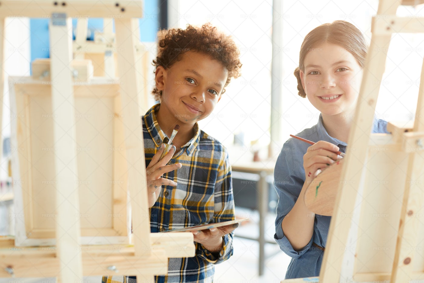 Kids By Easels: Stock Photos