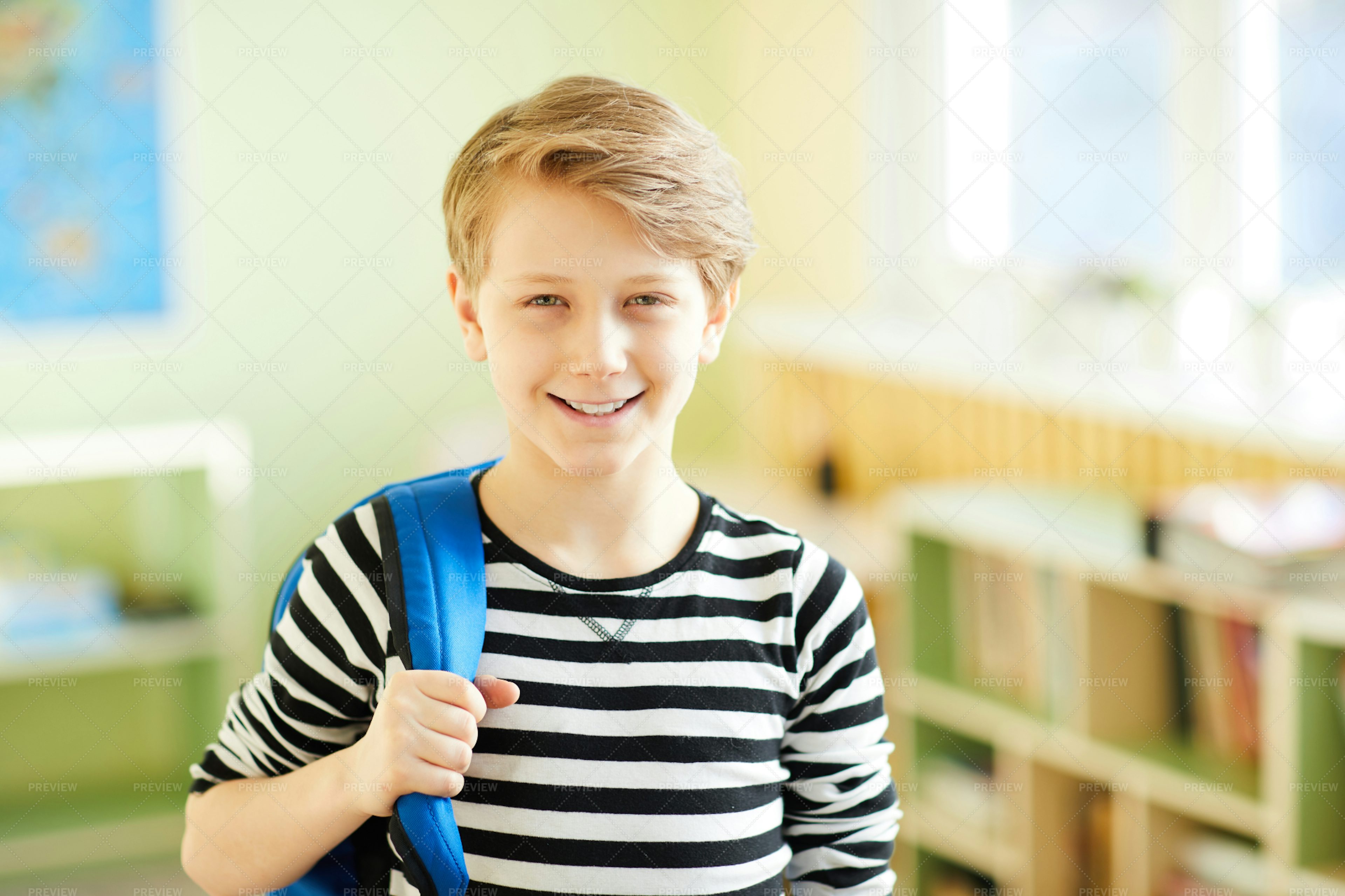 Cheerful Confident Pupil In Corridor - Stock Photos 