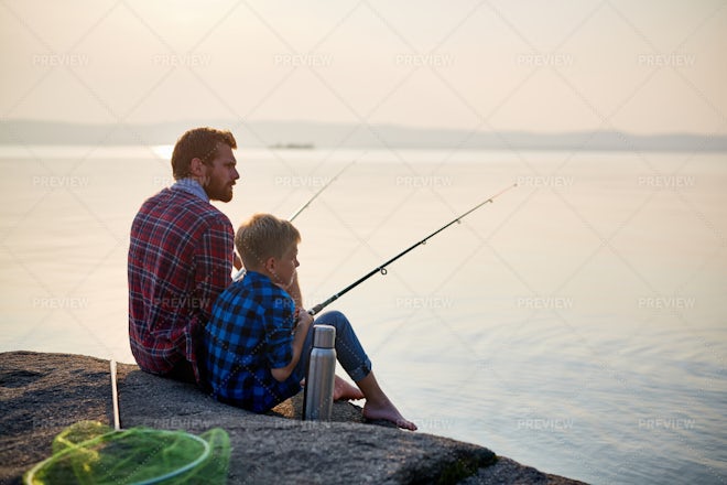 Enjoying fishing with dad Stock Photo by Pressmaster