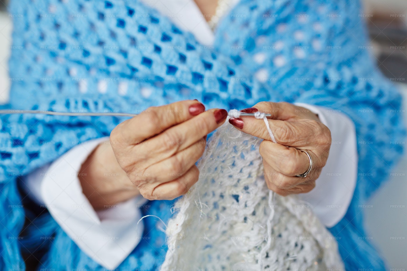 Close-up Of Senior Woman Hands Knitting: Stock Photos