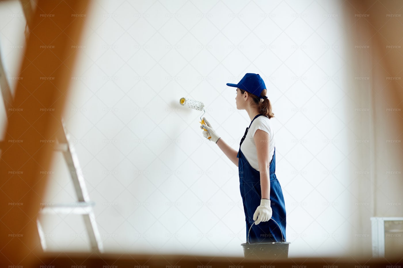Female Painter Whitewashing Walls: Stock Photos