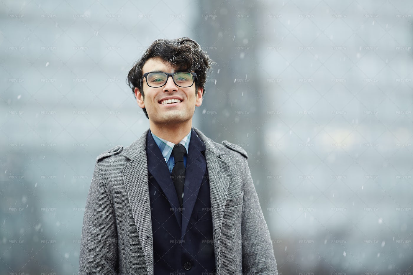 Smiling Young Businessman In Snow: Stock Photos