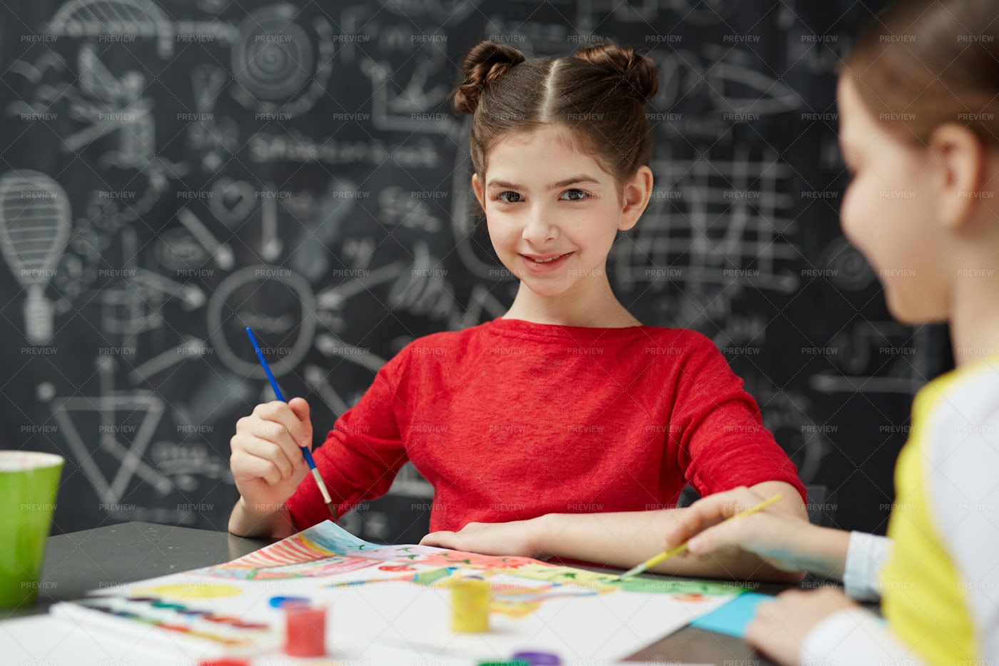 Smiling Schoolgirl Painting In Art Class: Stock Photos