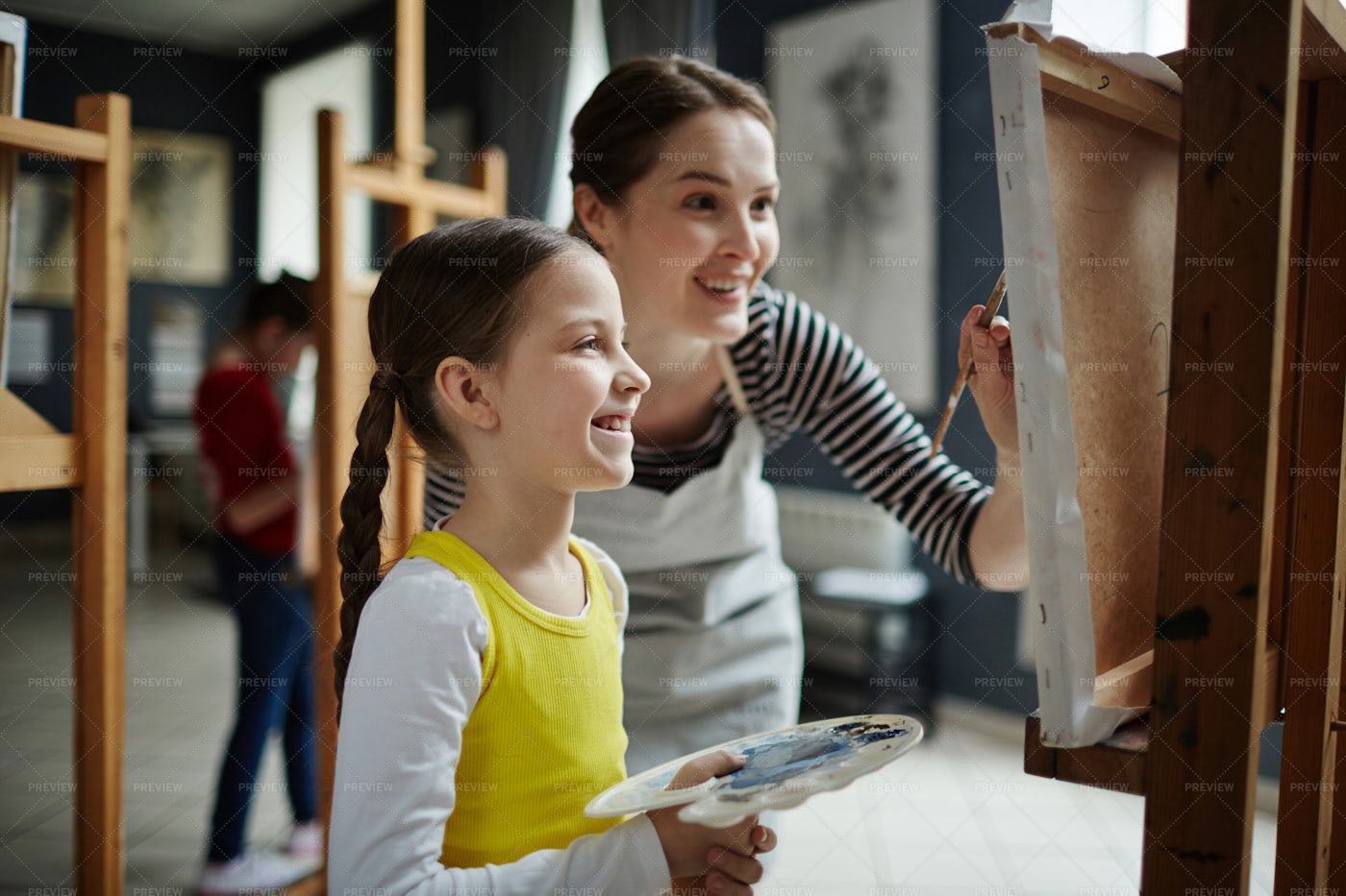 Girl Painting In Art Class: Stock Photos