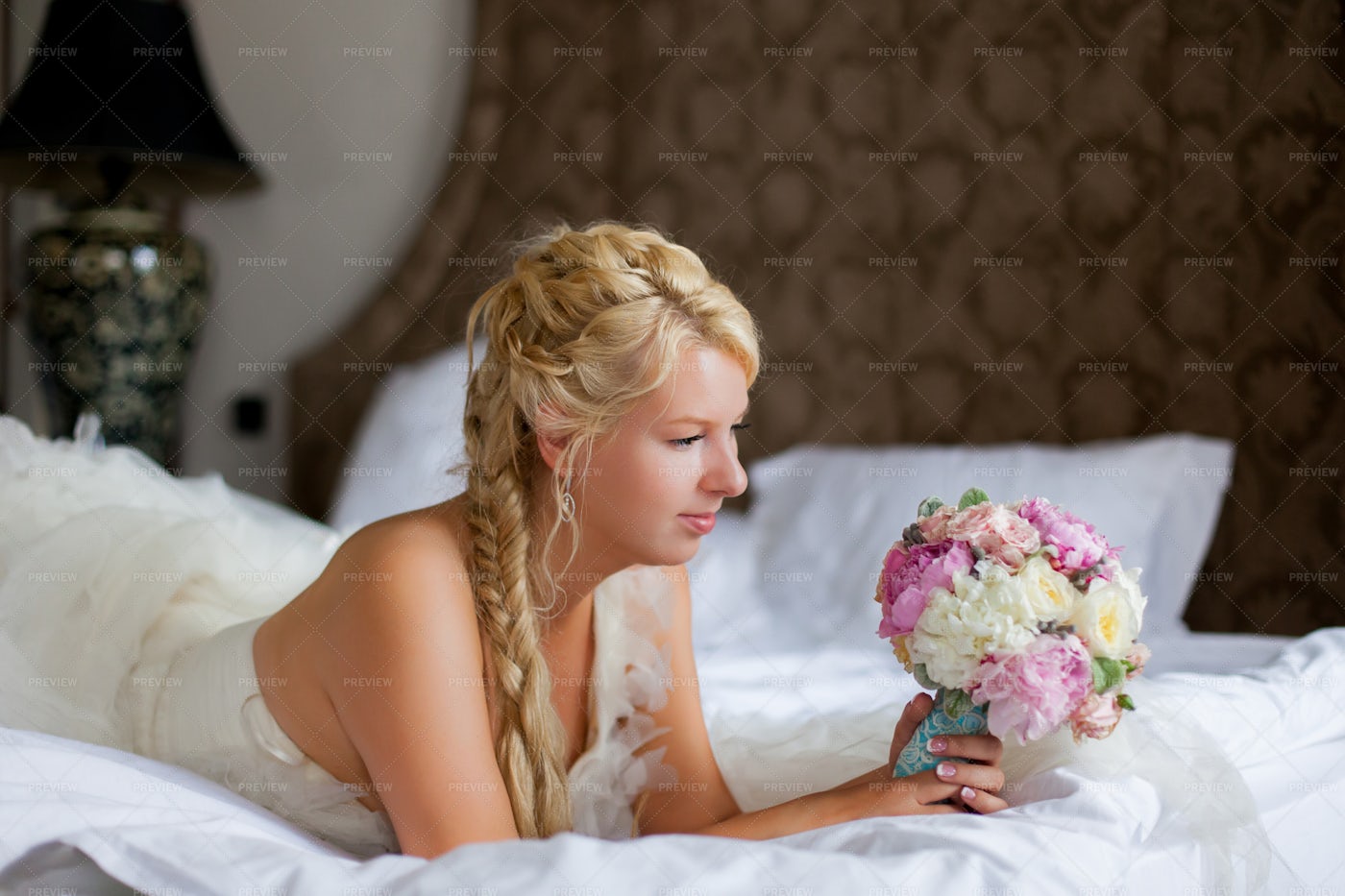 Woman Looking At Her Flower Bouquet: Stock Photos