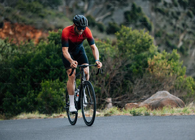 Male Road Bike Rider Doing Intense And Tough Training In Wild Terrain ...