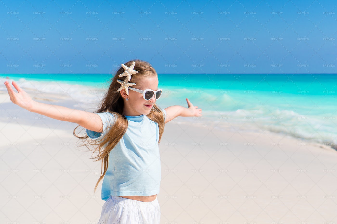 Girl With Starfish In Her Hair: Stock Photos