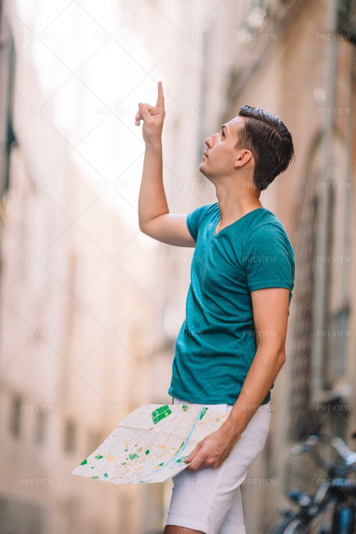 Pointing Upwards In Alley: Stock Photos