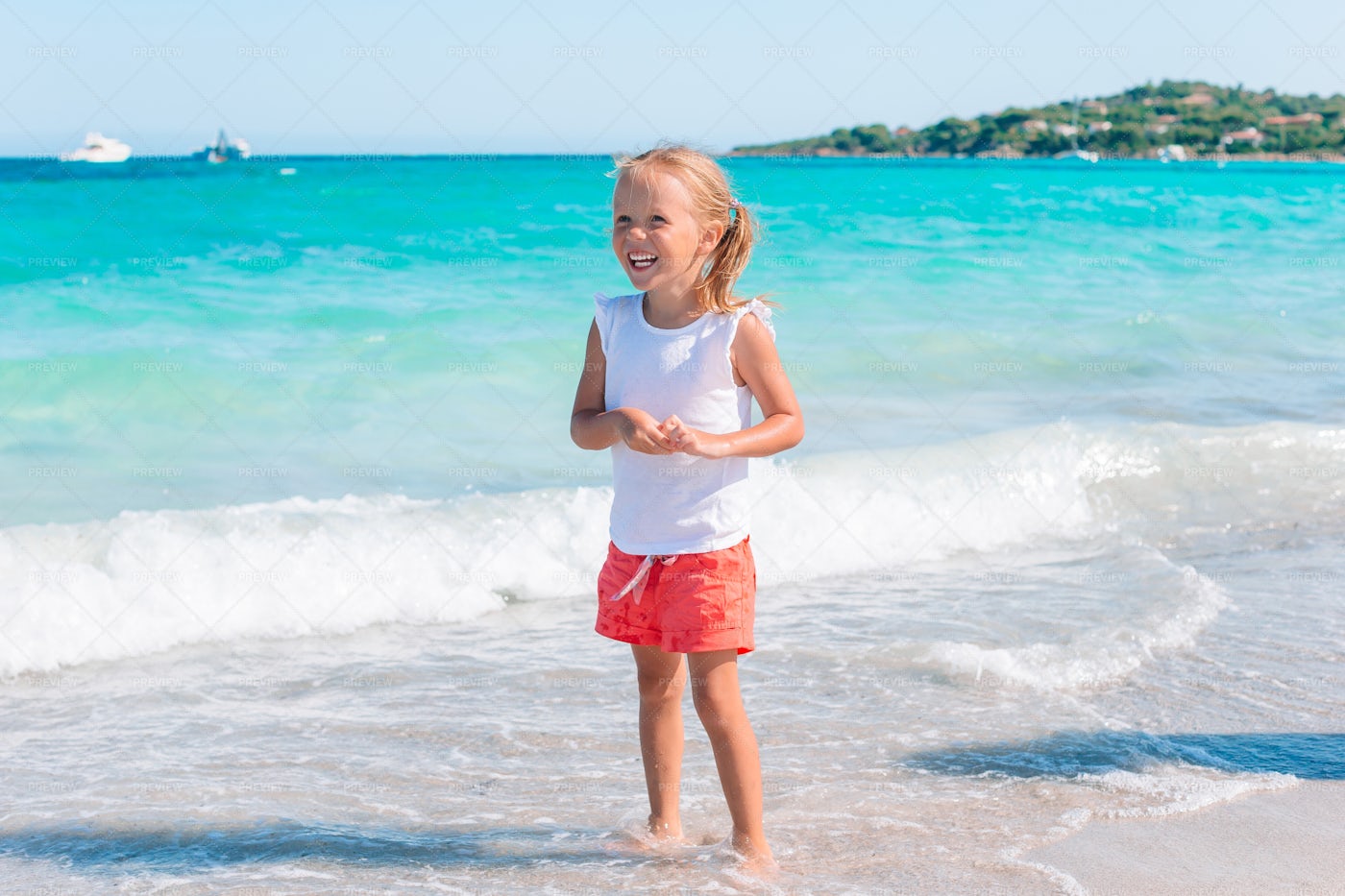 Little Girl Smiling On Shore: Stock Photos