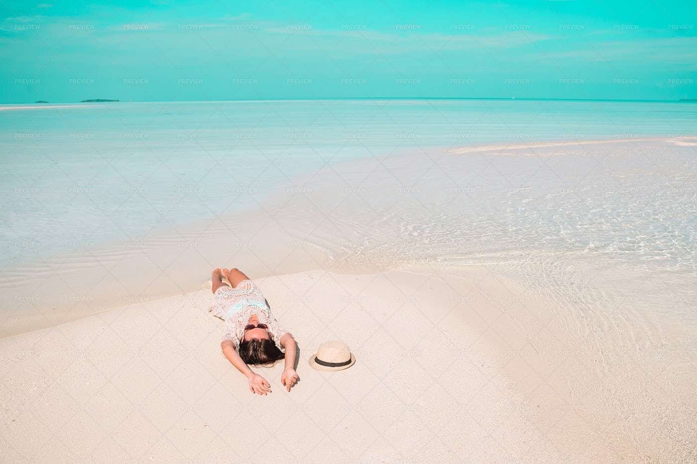Woman Lays On Shoreline: Stock Photos