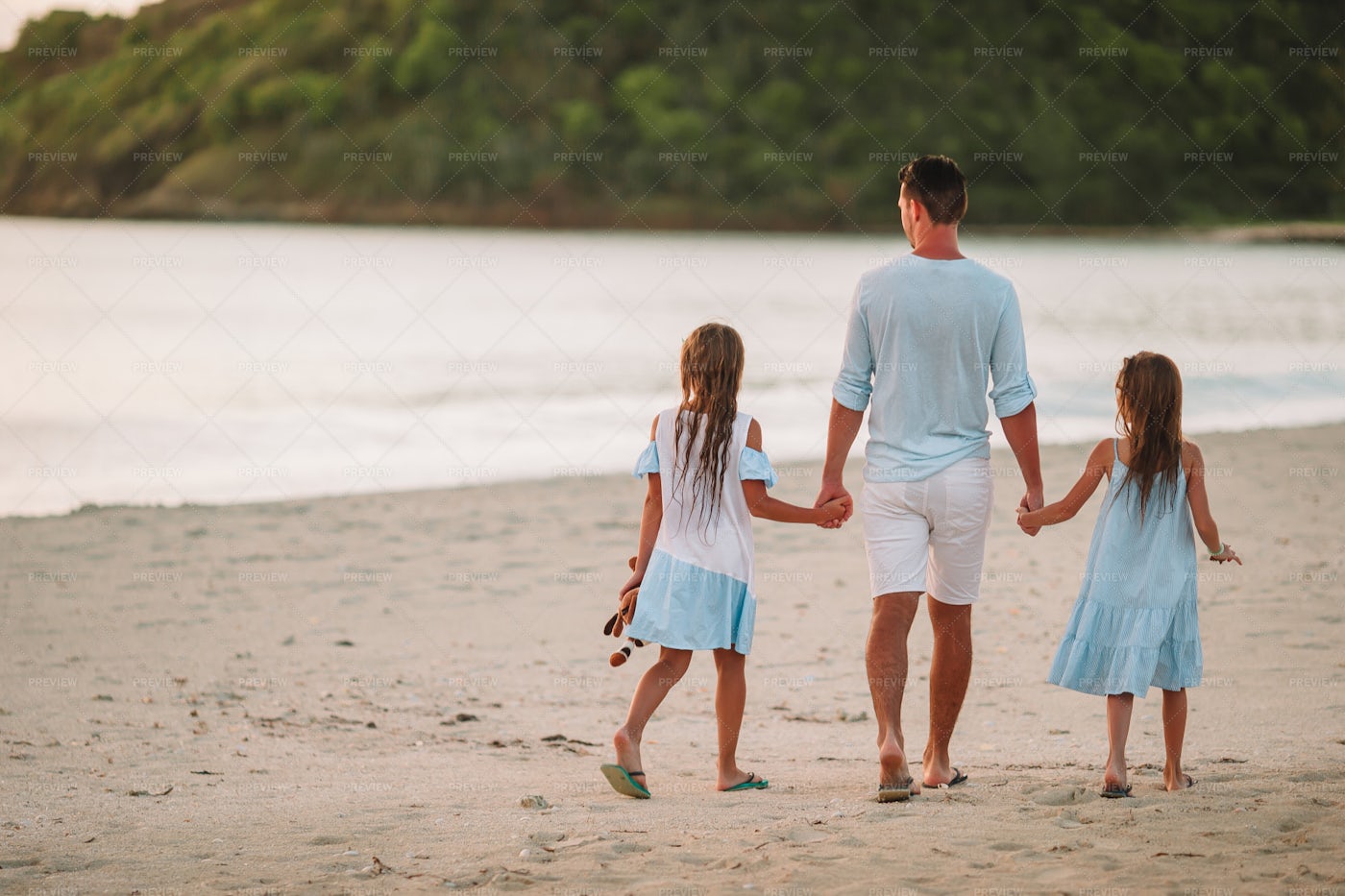 Father And Daughter Walking On The Beach: Stock Photos