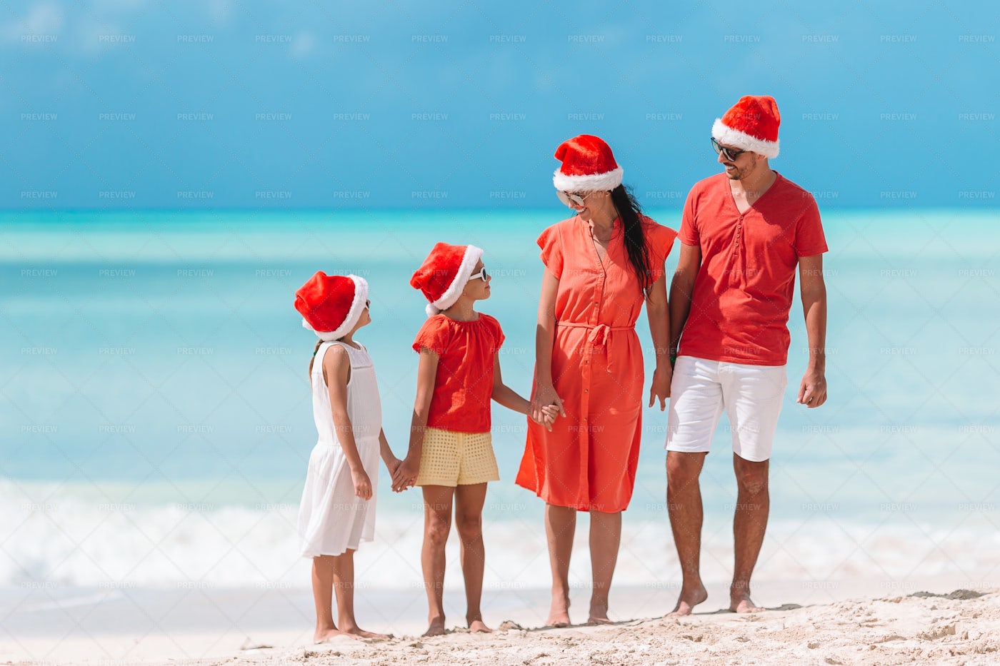 Family With Two Kids In Santa Hat: Stock Photos