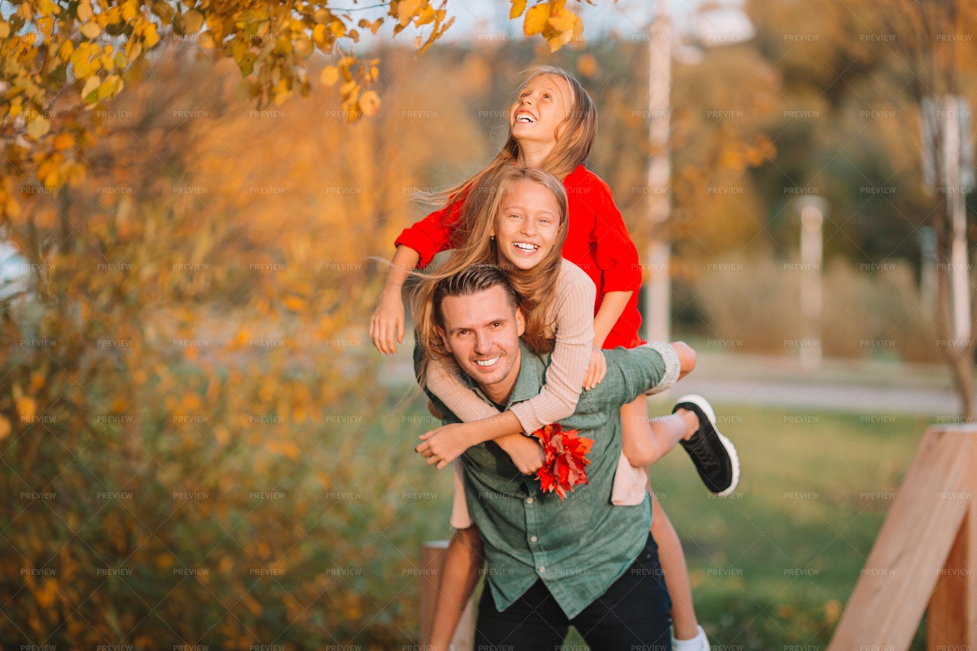 Carrying Daughters On Back: Stock Photos
