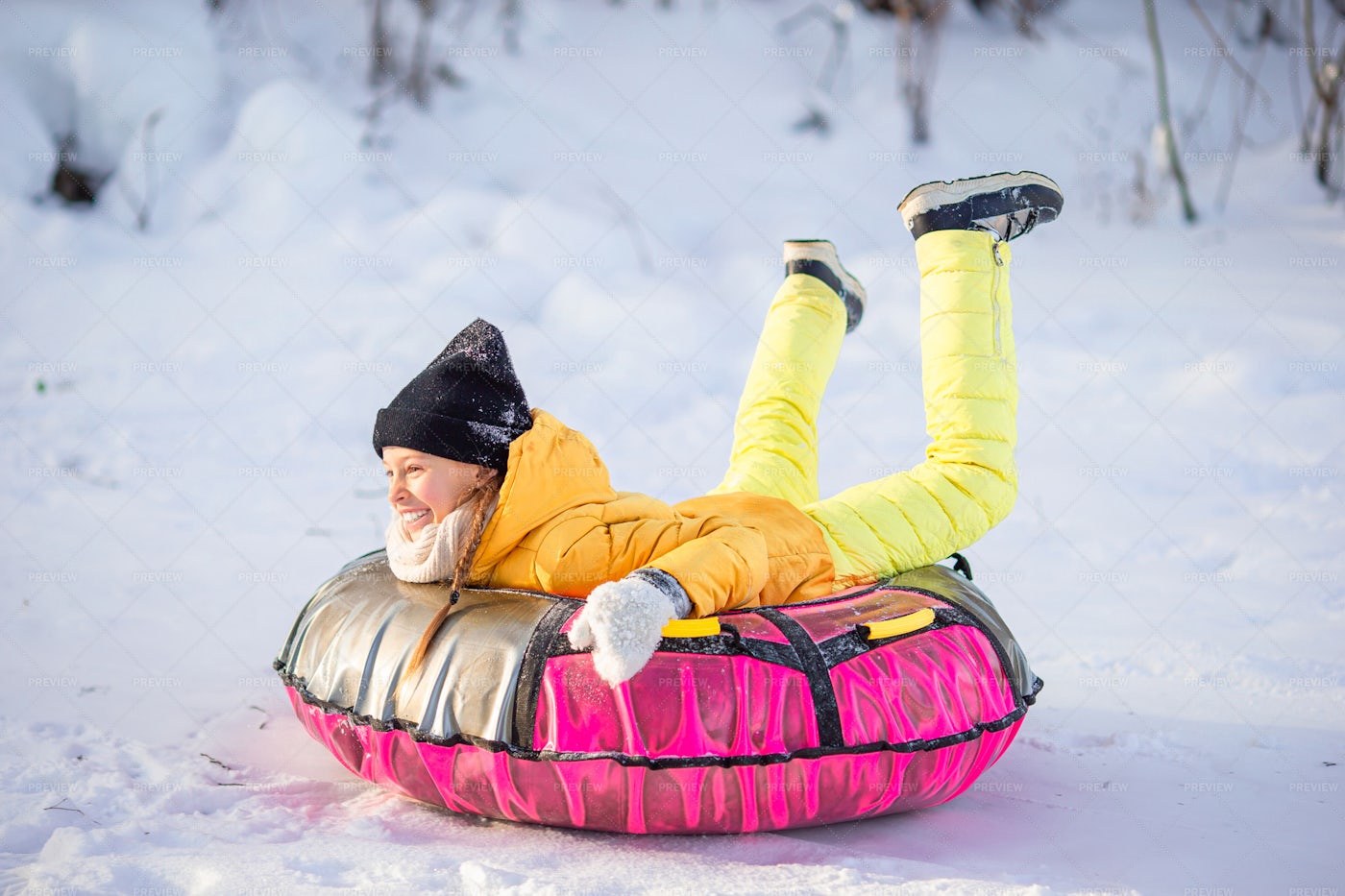 Sledding On Rubber Ring: Stock Photos