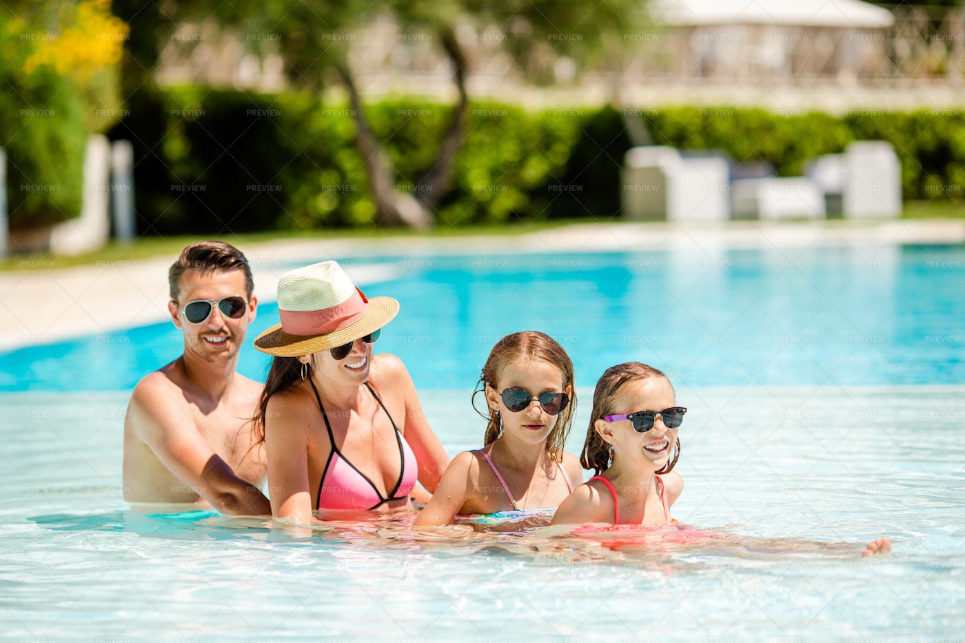 Family In A Swimming Pool: Stock Photos