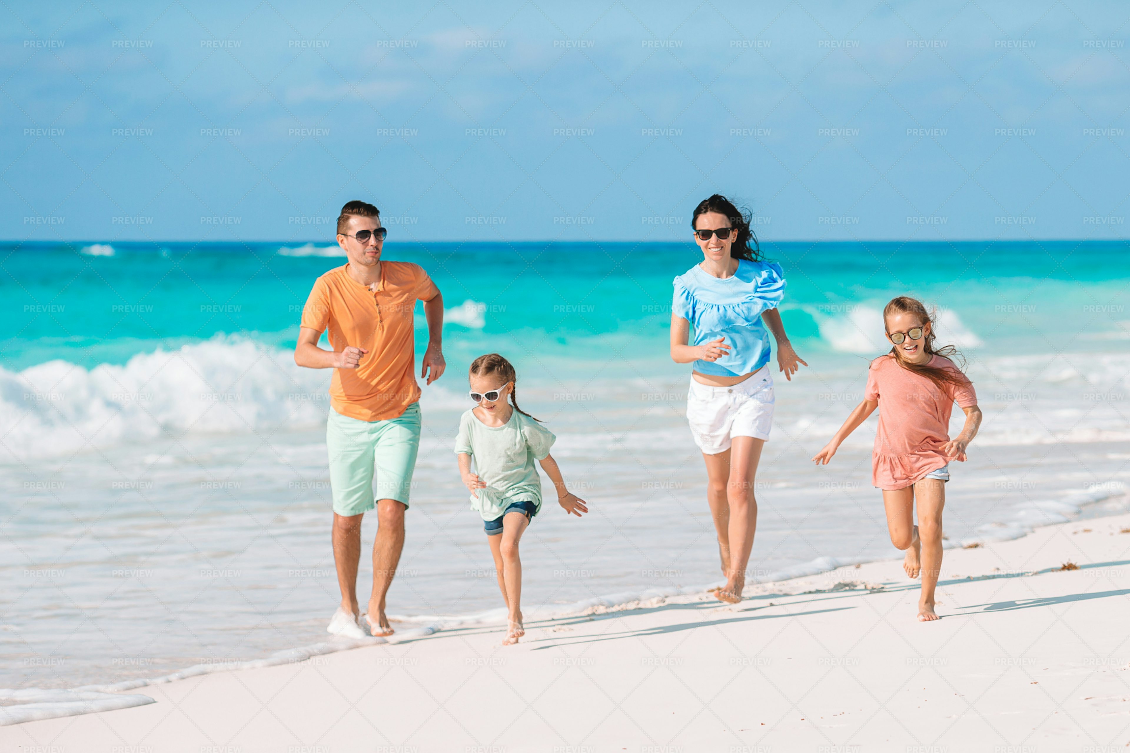 Running On Beach With Family - Stock Photos | Motion Array