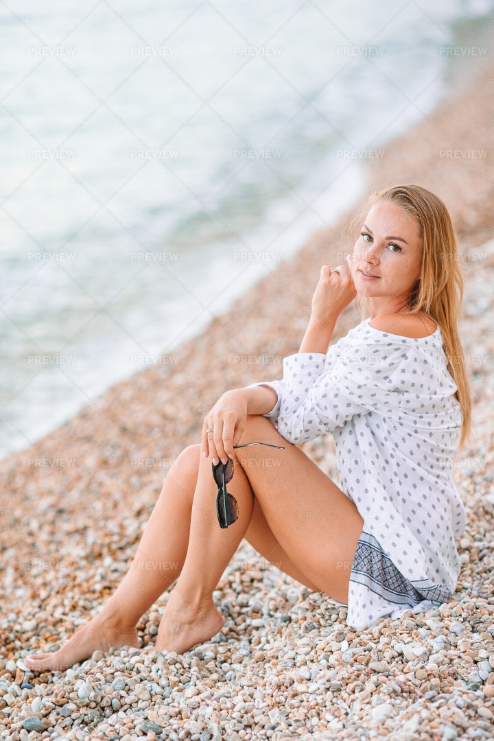 Sitting On The Seashore: Stock Photos