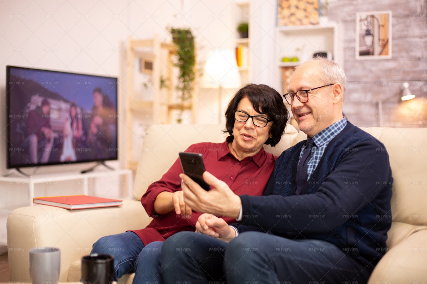 Elderly Couple Using A Smartphone: Stock Photos