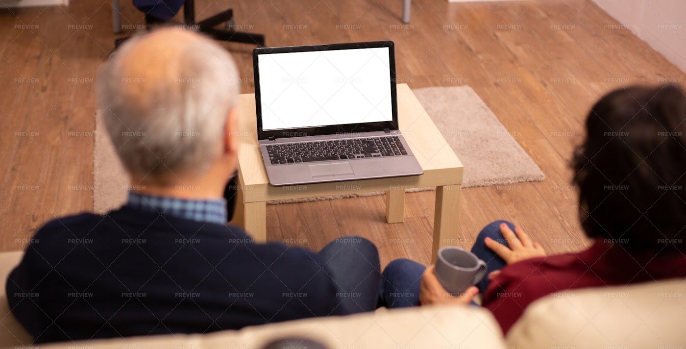 Back View Of Old Couple In Their Living: Stock Photos