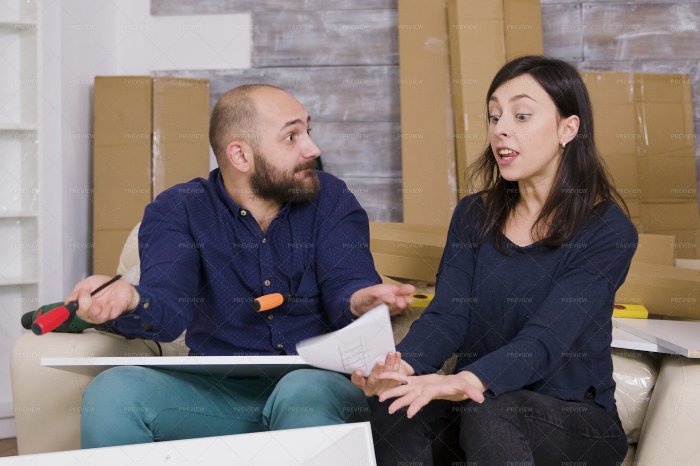Frustrated Couple Building Furniture: Stock Photos