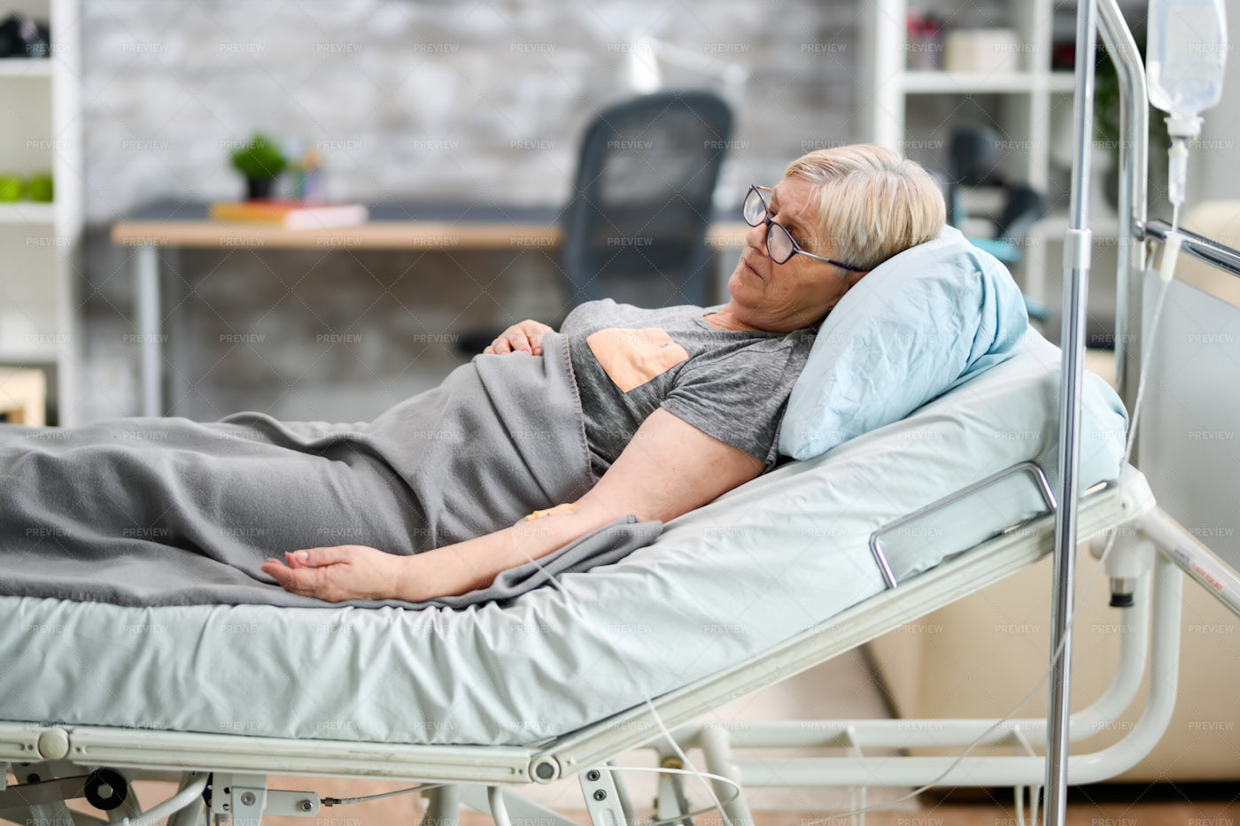 Female In A Nursing Home Bed: Stock Photos