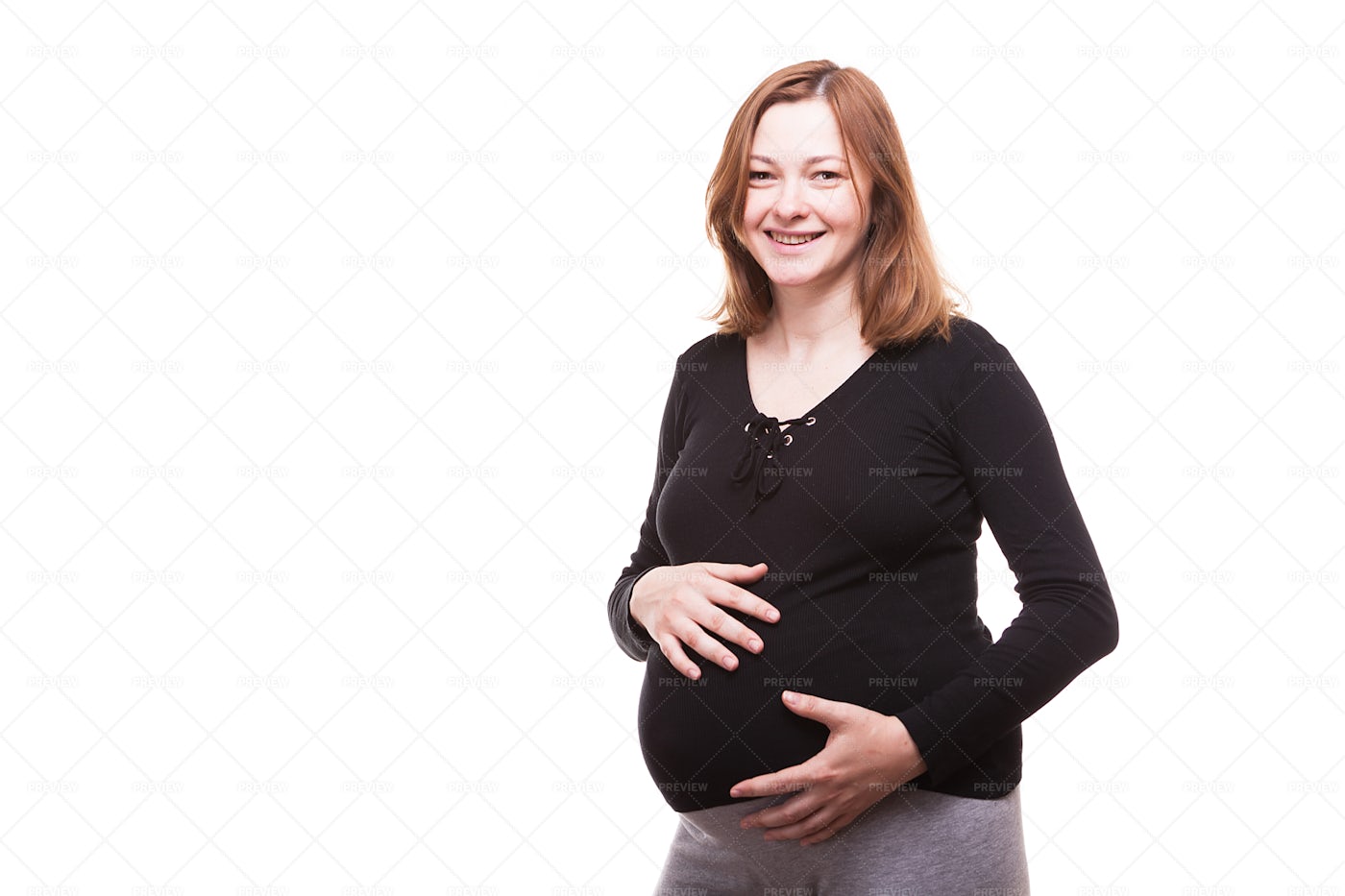 Happy Pregnant Woman Holding Her Belly: Stock Photos