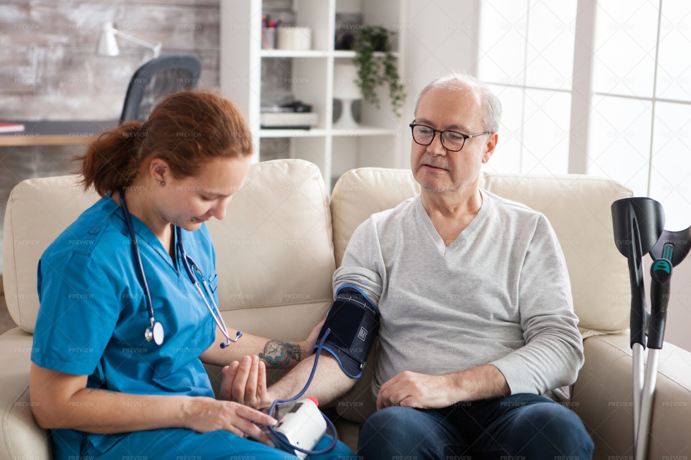 Female Doctor Reading Blood Pressure: Stock Photos