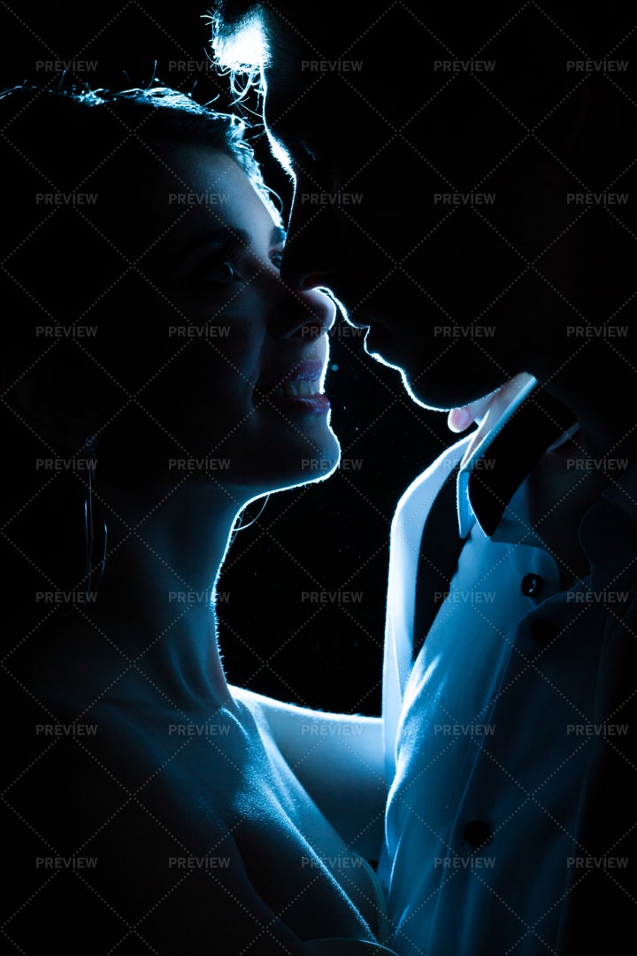 Newlyweds Kiss In Blue Light: Stock Photos