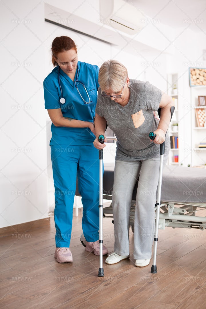 Nurse Helping Patient Walk: Stock Photos