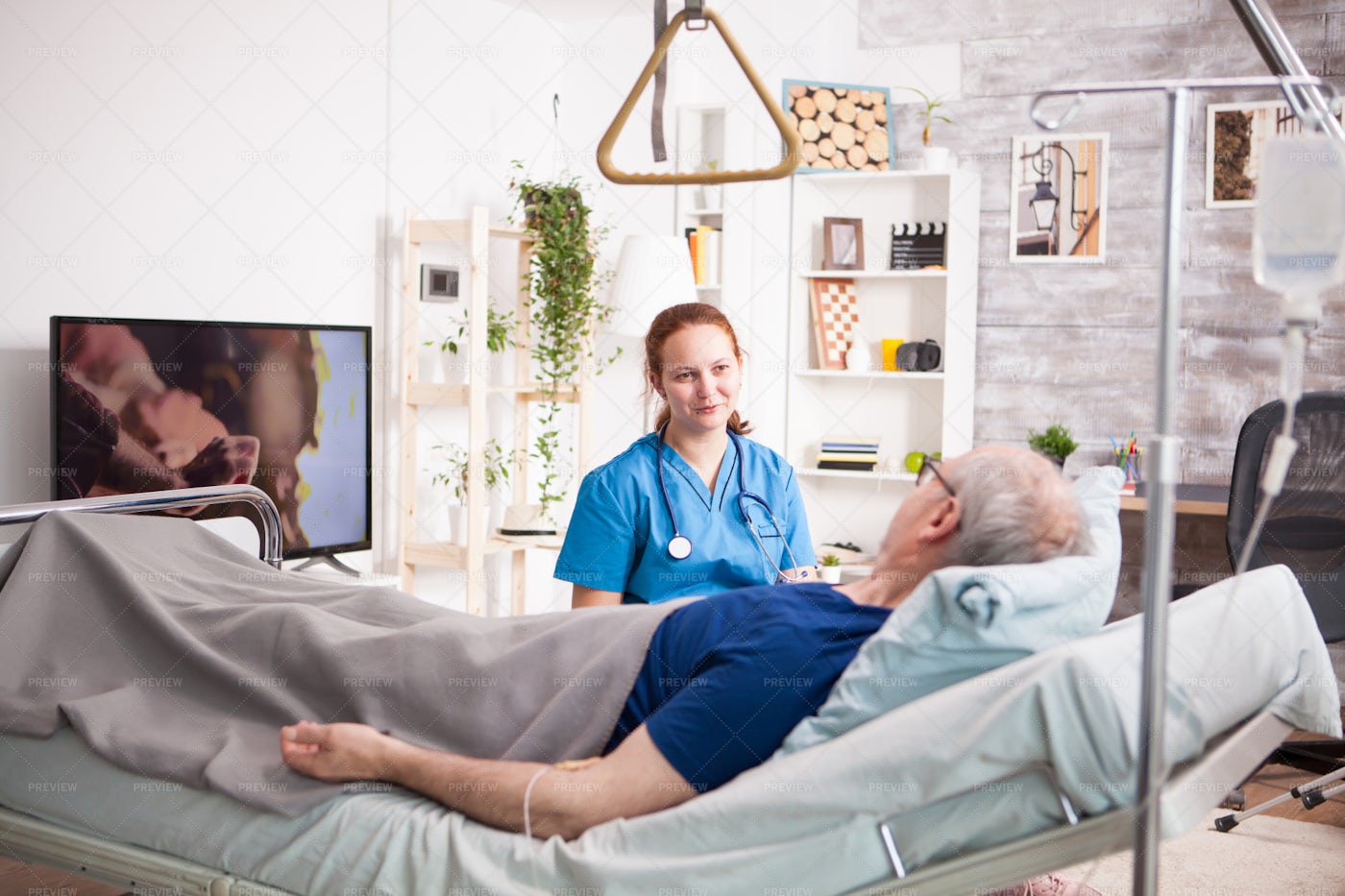 Man In Bed Beside Nurse: Stock Photos
