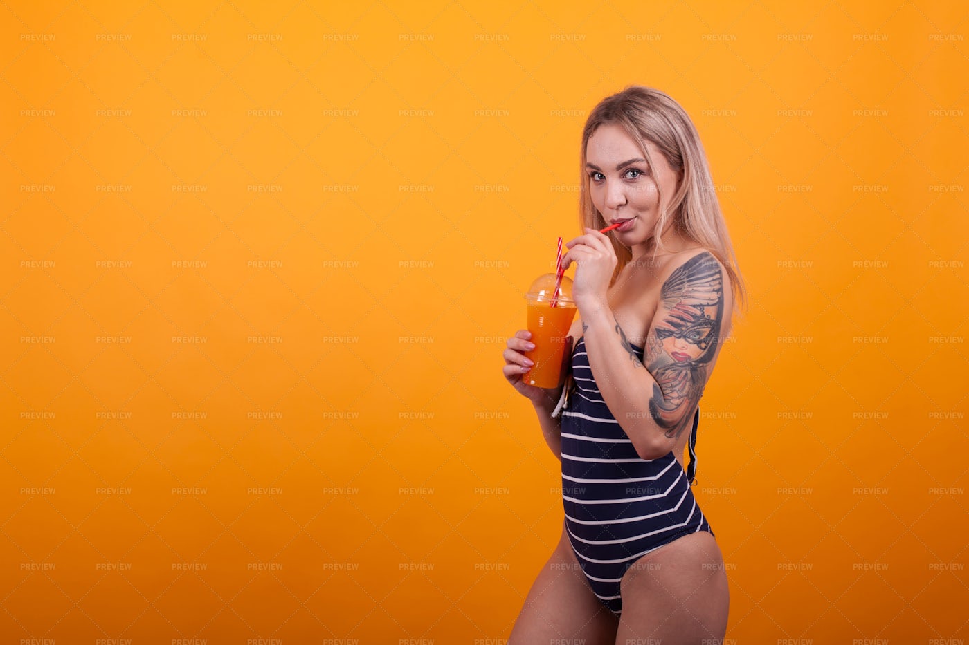 Side View Of Girl Drinking Juice: Stock Photos