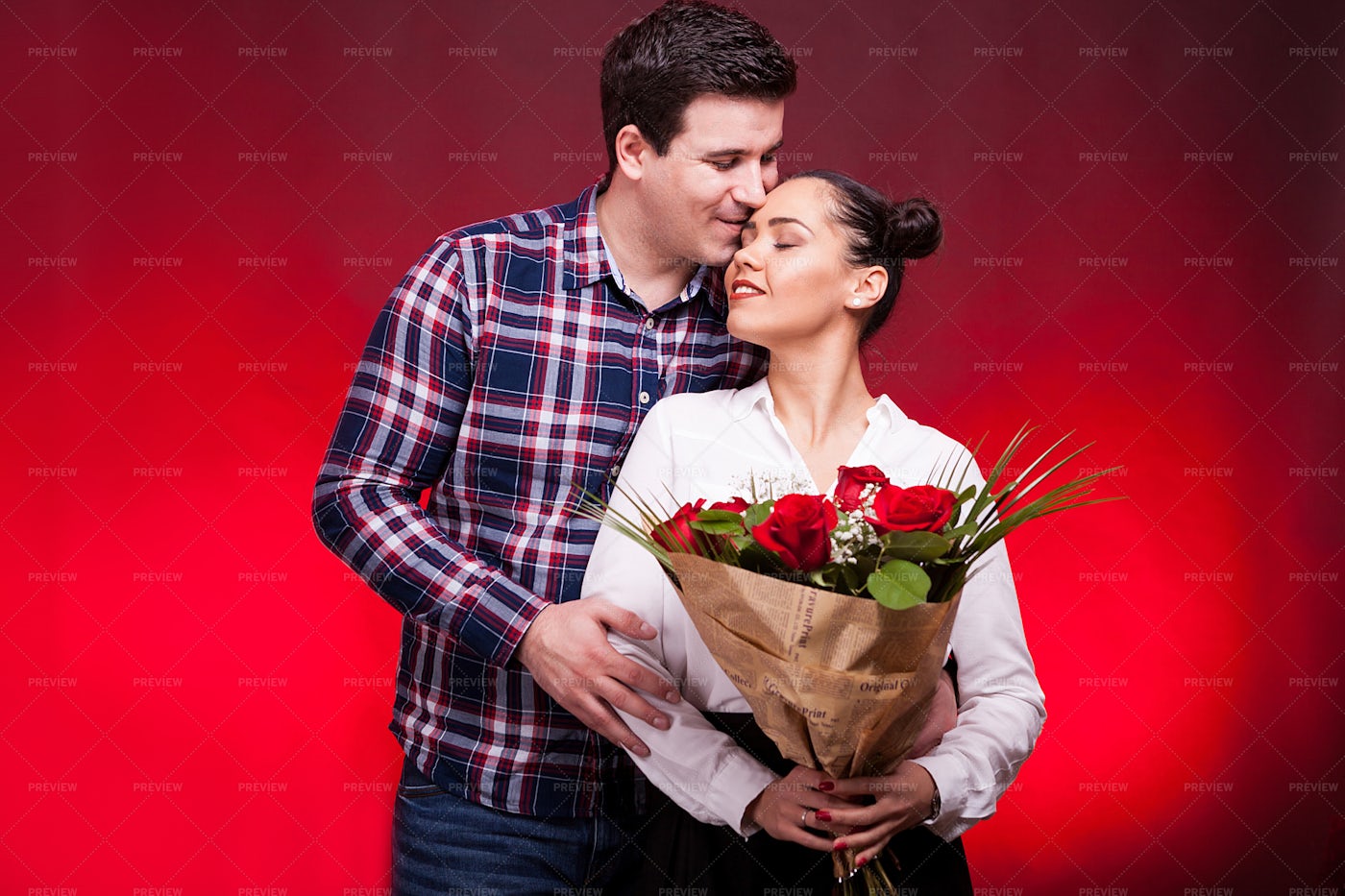 Man Embracing Woman With Roses: Stock Photos
