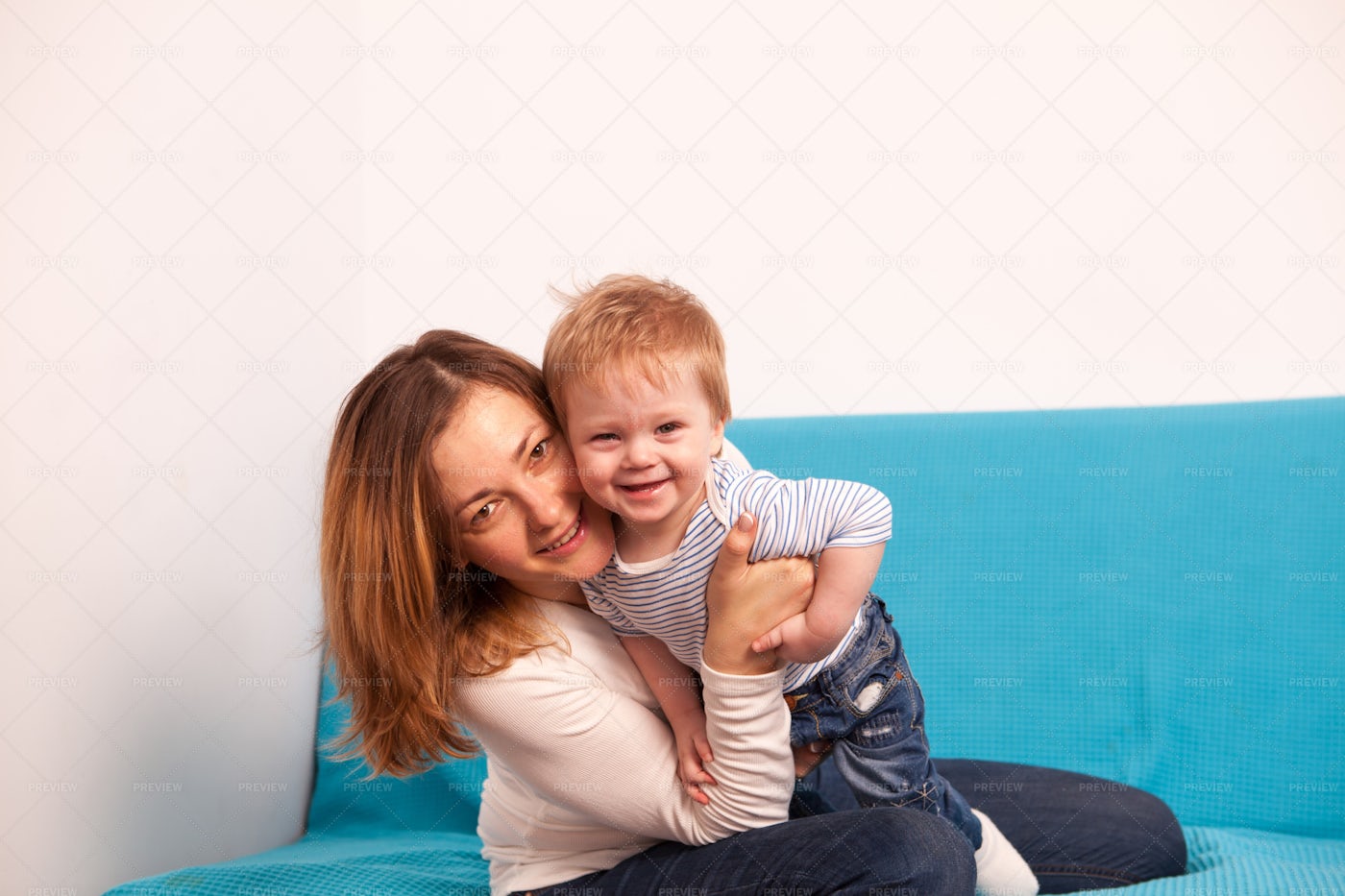 Mother And Laughing Son Playing: Stock Photos